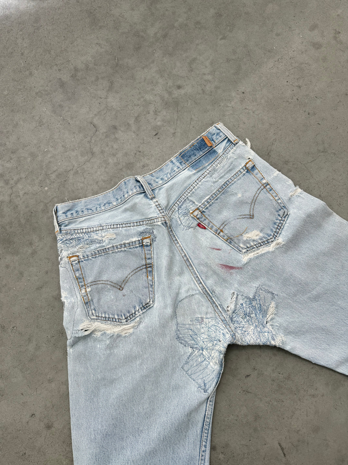 DISTRESSED FADED BLUE LEVIS REPAIR JEANS - 1990S