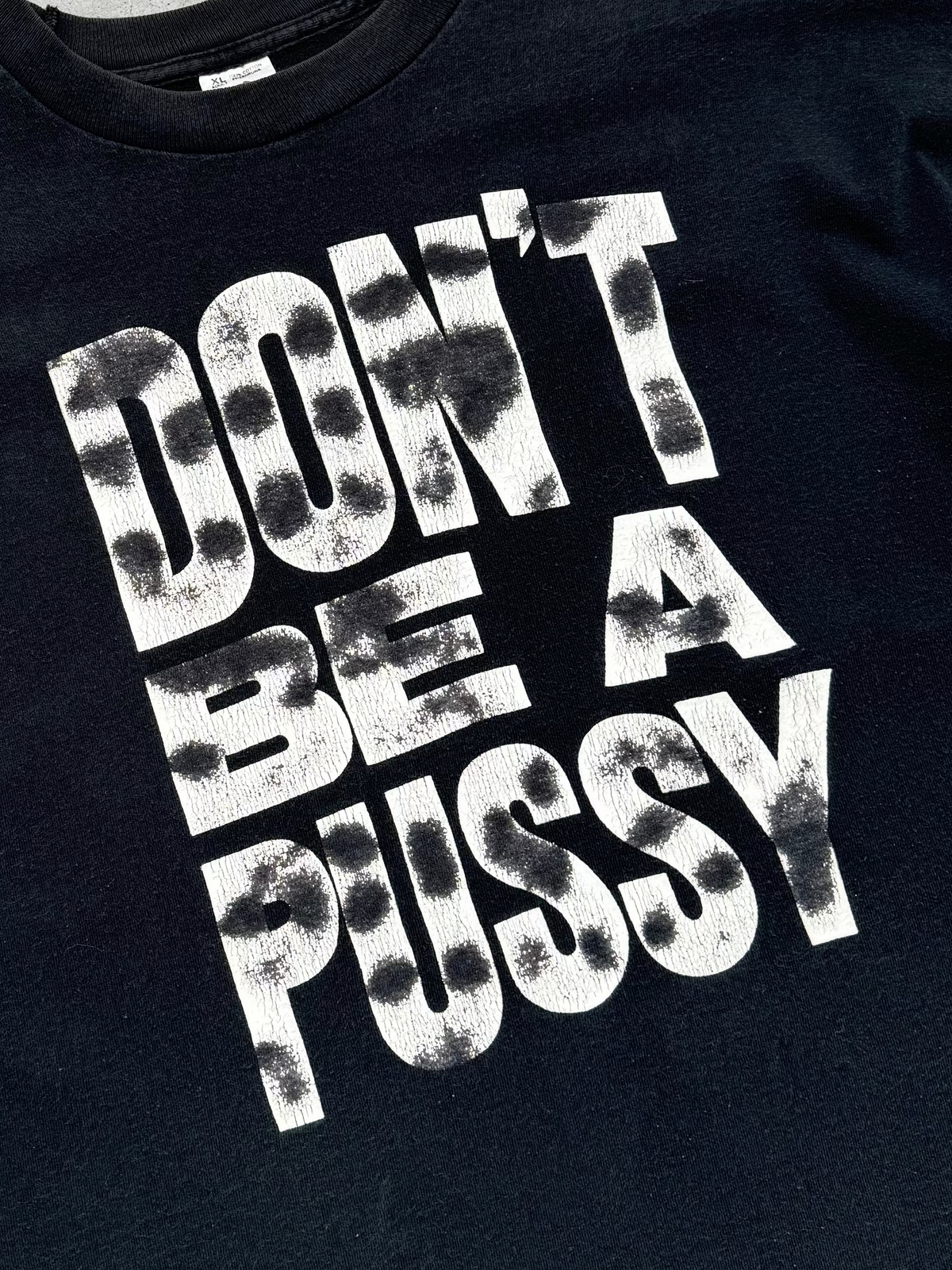 “DON'T BE A PUSSY” FADED BLACK TEE - 1990S