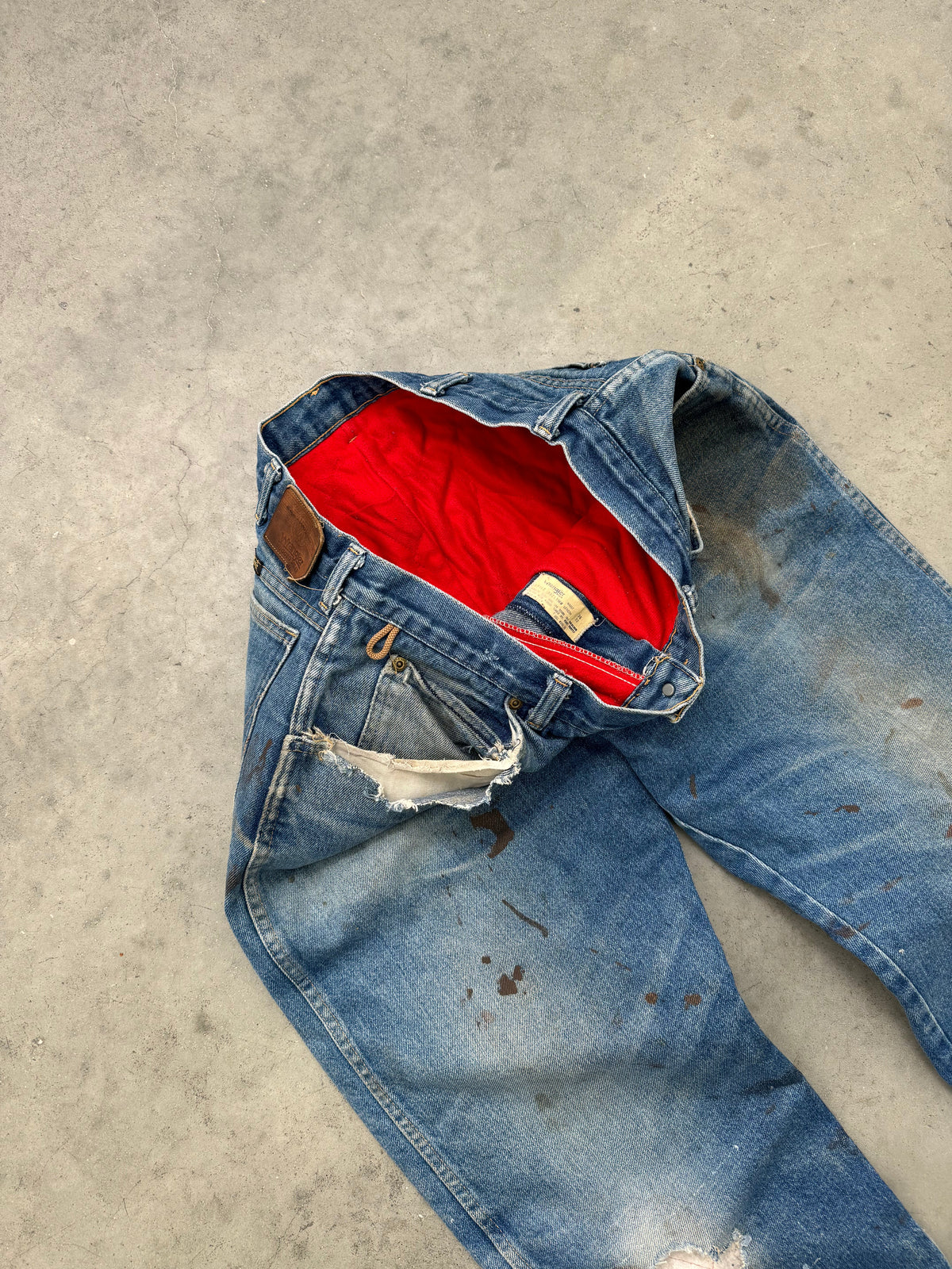 FADED & DISTRESSED RED FLANNEL LINED WRANGLER DENIM - 1980S