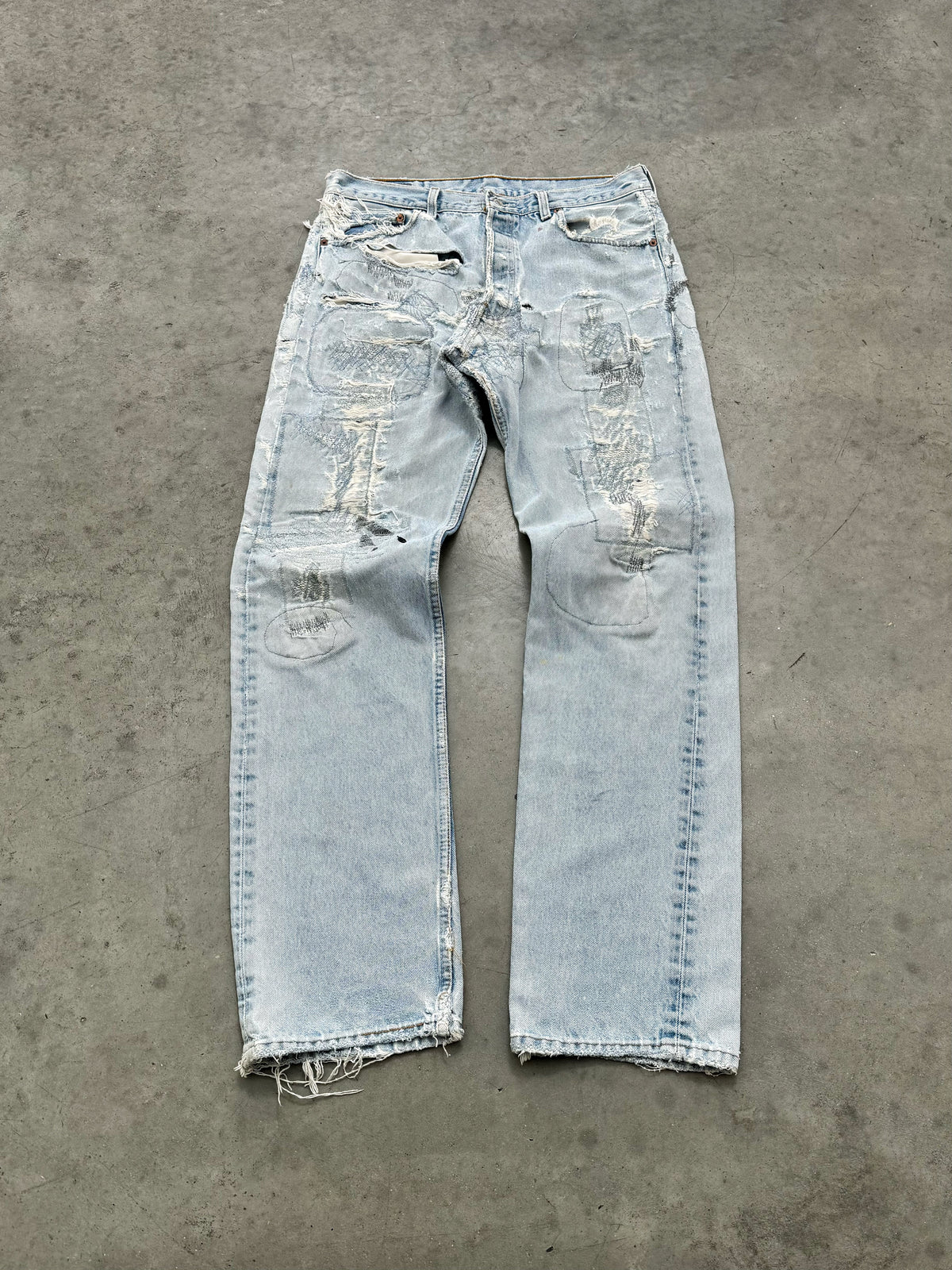 DISTRESSED FADED BLUE LEVIS REPAIR JEANS - 1990S