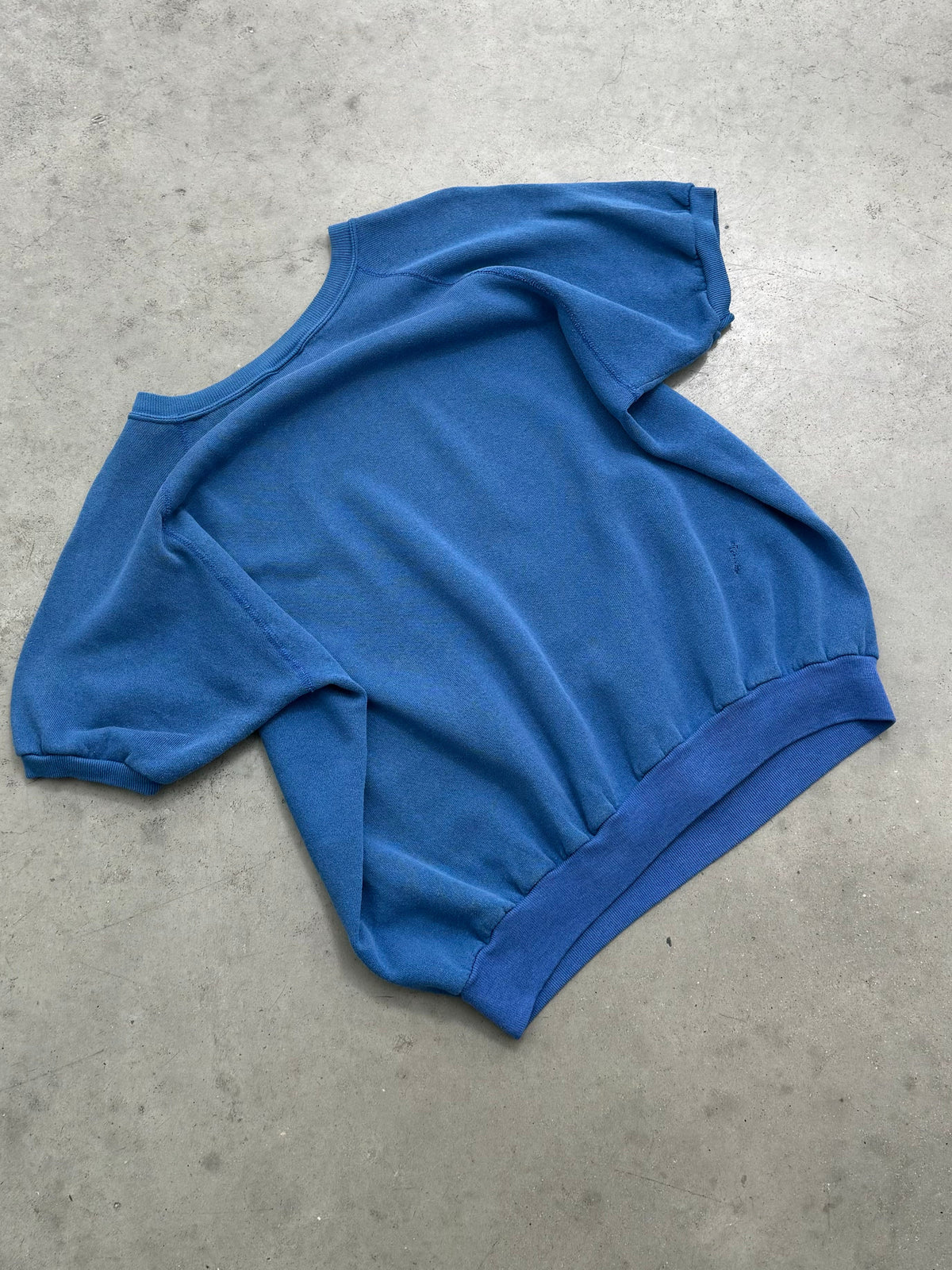 DISTRESSED & FADED BLUE SHORT SLEEVE RAGLAN CREWNECK - 1980S