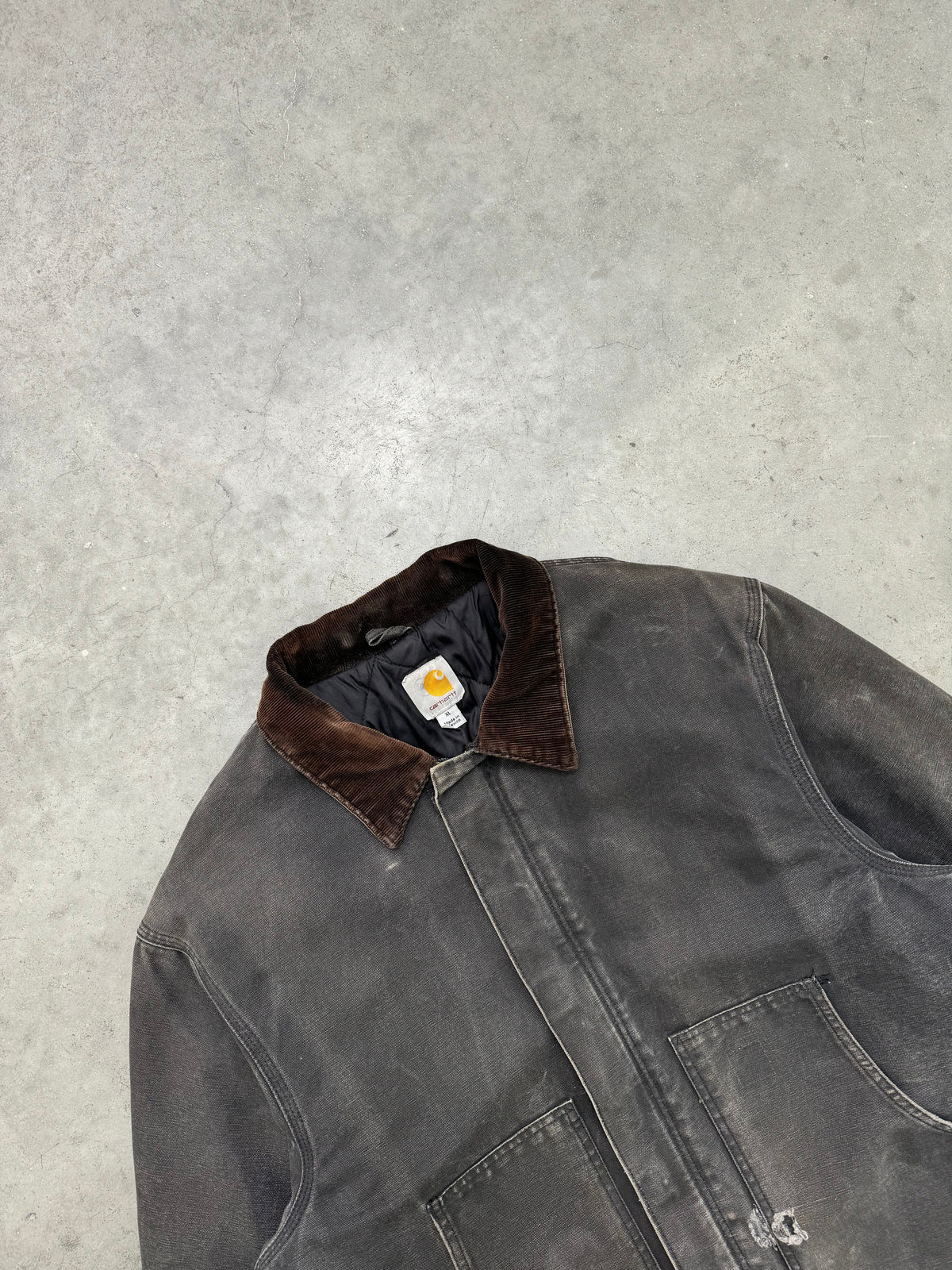 FADED BLACK AND DISTRESSED CARHARTT JACKET - 1990S